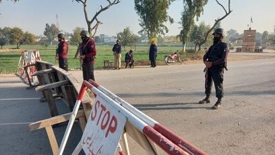Pakistani soldiers stand guard on a road leading to the cantonment area in Bannu, Pakistan December 20, 2022. (REUTERS)