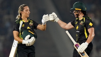 Grace Harris and Ashleigh Gardner return to the pavilion after the first inning during the 5th T20I (PTI) Grace Harris and Ashleigh Gardner return to the pavilion after the first inning during the 5th T20I (PTI)