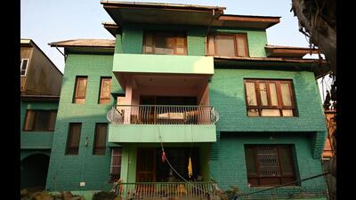 The two-storeyed residential structure in the name of late Hurriyat leader Syed Ali Geelani and one Firdous Ahmad Asmi at Barzulla in Srinagar. (Waseem Andrabi /Hindustan Times)