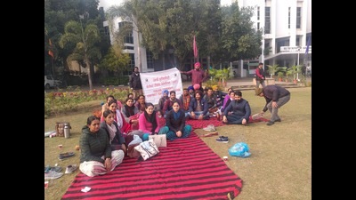 The university terminated the services of twenty sanitation workers, who are among those protesting since November 22 for regularization of their services. (HT photo)