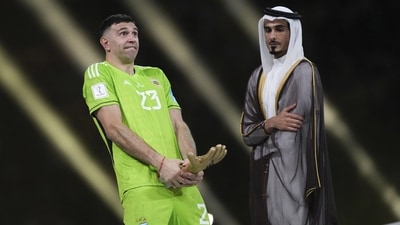 Argentina's goalkeeper Emiliano Martinez gestures after receiving the the Golden Glove award for the best goalkeeper after the FIFA World Cup final. (AP) Argentina's goalkeeper Emiliano Martinez gestures after receiving the the Golden Glove award for the best goalkeeper after the FIFA World Cup final. (AP)