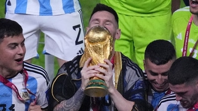 Argentina's Lionel Messi kisses the trophy as he celebrates with his teammates at the end of the World Cup final (AP) Argentina's Lionel Messi kisses the trophy as he celebrates with his teammates at the end of the World Cup final (AP)