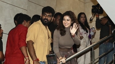 Vignesh Shivan with Nayanthara at a movie theatre in Chennai. Vignesh Shivan with Nayanthara at a movie theatre in Chennai.