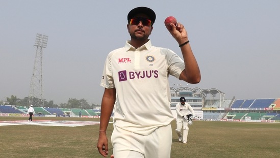 Kuldeep Yadav shows the ball after taking five wicket during the first Test cricket match day third between Bangladesh and India (AP)