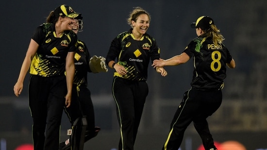 Heather Graham (2R) celebrates with teammates after taking the wicket of Renuka Singh (not pictured), which also saw her complete a hattrick in the 5th T20I(AFP)