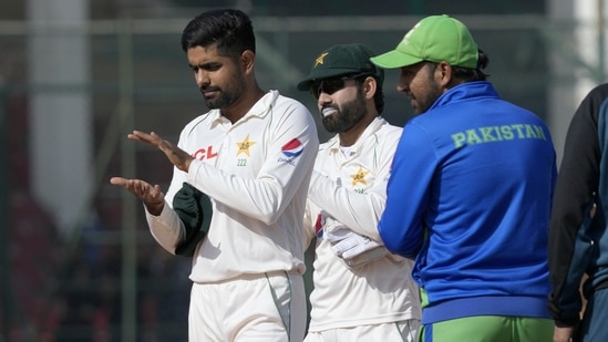 Pakistan's skipper Babar Azam, left,, Mohammad Rizwan, center, and Sarfraz Ahmed, clap for teammate Azhar Ali, who played his last match (AP)