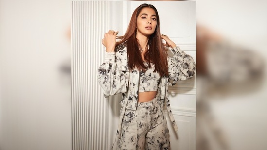 Pooja Hegde's three-piece set comprises a bralette, high-rise joggers and a cropped jacket. (Instagram/@hegdepooja)