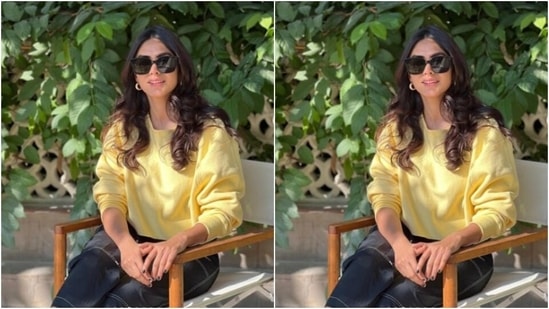 Mrunal wore her tresses open in wavy curls with a middle part as she posed for the pictures. (Instagram/@mrunalthakur)