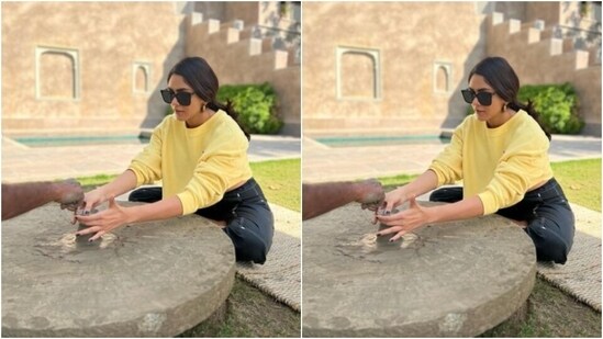 Mrunal posed in a yellow baggy sweatshirt with closed neckline and full sleeves, folded. She further teamed her sweatshirt with a pair of black capris featuring white borders.&nbsp;(Instagram/@mrunalthakur)