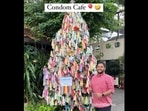Soham Sinha is posing with a Christmas tree inside Thailand's condom-themed cafe. (Instagram/@kolkatadelites) Soham Sinha is posing with a Christmas tree inside Thailand's condom-themed cafe. (Instagram/@kolkatadelites)