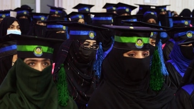 In this file photo from March 17, female students from the faculties of Engineering and Computer Science attend their graduation ceremony at Benawa University in Kandahar. Qatar and Pakistan, both Muslim countries, have expressed their disappointment at the university ban and urged authorities to reconsider their decision. (Javed Tanveer / AFP) In this file photo from March 17, female students from the faculties of Engineering and Computer Science attend their graduation ceremony at Benawa University in Kandahar. Qatar and Pakistan, both Muslim countries, have expressed their disappointment at the university ban and urged authorities to reconsider their decision. (Javed Tanveer / AFP)