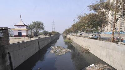 A drain in Greater Noida. In a similar incident on October 15, a 22-year-old second-year student of Galgotias University in Greater Noida was found dead in a drain near the campus, three days after he had been reported missing. (HT Photo)