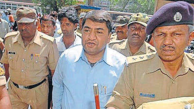 Abdul Karim Telgi, center, the prime accused in the multi billion fake stamp paper scam, is produced in a court in Ahmadabad, India, Wednesday, March 18, 2009. (AP Photo/Ajit Solanki) (AP) Abdul Karim Telgi, center, the prime accused in the multi billion fake stamp paper scam, is produced in a court in Ahmadabad, India, Wednesday, March 18, 2009. (AP Photo/Ajit Solanki) (AP)