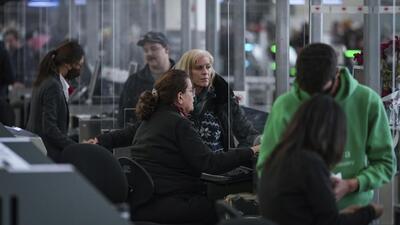 Air Canada employees assist passengers at Vancouver International Airport, in Richmond, British Columbia, on Tuesday. (AP) Air Canada employees assist passengers at Vancouver International Airport, in Richmond, British Columbia, on Tuesday. (AP)