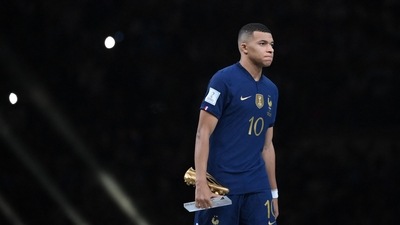 France's forward Kylian Mbappe holds the Golden Boot award during the Qatar 2022 World Cup trophy ceremony after the football final match between Argentina and France at Lusail Stadium in Lusail, north of Doha on December 18, 2022. - Argentina won in the penalty shoot-out. (Photo by FRANCK FIFE / AFP) (AFP)