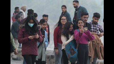 Residents brave the cold at Sukhna Lake in Chandigarh on Wednesday. (Keshav Singh/HT)