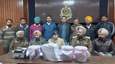 Senior superintendent of police Kanwardeep Kaur giving details of the recovery of drugs and weapons from smugglers in Ferozepur on Wednesday. (HT Photo)