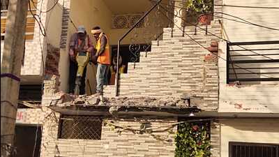 These building violations were in the shape of cantilever and illegal RCC stair on government land. CHB is computing cost of demolitions, which will be recovered from the allottees and in case of its non-payment, their allotments are liable to be cancelled. (HT Photo)