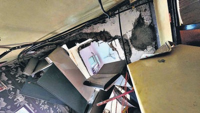 Two persons injured after a slab collapsed and came crashing down from the 3rd floor till the ground floor in Anurag CHS, Liberty Garden, at Malad West on Wednesday. Fortunately, there were no occupants in the bedrooms of the first and second floors below the damaged flat at the time, while the kitchen space in that vertical order on the ground floor was also empty. (Vijay Bate/HT Photo) Two persons injured after a slab collapsed and came crashing down from the 3rd floor till the ground floor in Anurag CHS, Liberty Garden, at Malad West on Wednesday. Fortunately, there were no occupants in the bedrooms of the first and second floors below the damaged flat at the time, while the kitchen space in that vertical order on the ground floor was also empty. (Vijay Bate/HT Photo)