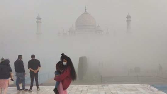 Tourists at the Taj Mahal on a foggy, winter day, in Agra on December 19. Typically, northwest India sees 2-3 moderate to strong western disturbances in November and 2-3 in December. This year it saw none since November 10, a situation that hasn’t changed thus far in December, HT reported.(ANI )