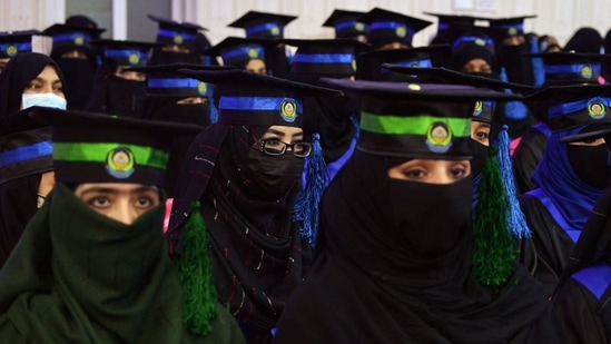 In this file photo from March 17, female students from the faculties of Engineering and Computer Science attend their graduation ceremony at Benawa University in Kandahar. Qatar and Pakistan, both Muslim countries, have expressed their disappointment at the university ban and urged authorities to reconsider their decision.&nbsp;(Javed Tanveer / AFP)