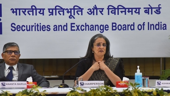 SEBI chairperson Madhabi Puri Buch with Whole Time Members (WTM) Ananta Barua (left) and Ashwani Bhatia during a press conference, at SEBI head office in Mumbai, Tuesday.(PTI)