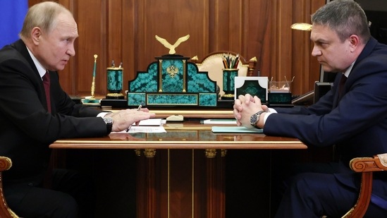 Russian President Vladimir Putin, left, speaks to Moscow-appointed head of Russian-controlled Luhansk region Leonid Pasechnik during their meeting at the Kremlin in Moscow, Russia, Tuesday, Dec. 20, 2022. (Mikhail Klimentyev, Sputnik, Kremlin Pool Photo via AP) Russian President Vladimir Putin, left, speaks to Moscow-appointed head of Russian-controlled Luhansk region Leonid Pasechnik during their meeting at the Kremlin in Moscow, Russia, Tuesday, Dec. 20, 2022. (Mikhail Klimentyev, Sputnik, Kremlin Pool Photo via AP)