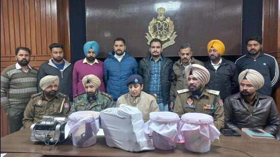 Senior superintendent of police Kanwardeep Kaur giving details of the recovery of drugs and weapons from smugglers in Ferozepur on Wednesday. (HT Photo)