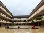 Residents are rescued by a boat from the flood relief centre after the flood water rose and partially submerged a building at Dungun, in Terengganu, Malaysia on December 21.  At least five people were killed after monsoon-triggered floods inundated the country's north. authorities said, as reported by AFP. (Reuters)