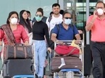 Passengers seen wearing face masks as they come out of the airport.