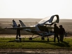 Employees of Israeli startup AIR work on a prototype of AIR ONE, an electric vehicle designed to fly commuters on short trips far above streets overcrowded with cars.