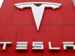 The logo of car manufacturer Tesla is seen at a branch office in Bern, Switzerland.