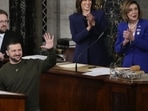 Ukrainian President Volodymyr Zelenskyy gestures towards the guests of the the Ukrainian delegation as he addresses a joint meeting of Congress on Capitol Hill in Washington, Wednesday, Dec. 21, 2022. Vice President Kamala Harris and House Speaker Nancy Pelosi of Calif., look on. (AP Photo/Jacquelyn Martin)(AP)