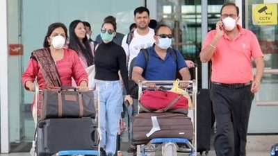Passengers seen wearing face masks as they come out of the airport. Passengers seen wearing face masks as they come out of the airport.