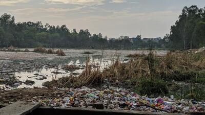 A pond in Greater Noida being used as wasteland. (HT Archvie)