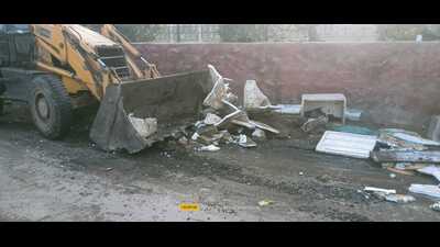 An illegal fish market being razed in Ludhiana on Thursday.