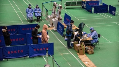 China reported 2,966 new cases on December 21 and there have been fewer than 10 Covid deaths since the beginning of December. (Bloomberg) China reported 2,966 new cases on December 21 and there have been fewer than 10 Covid deaths since the beginning of December. (Bloomberg)