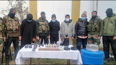 Terror associates in the custody of security forces in Kupwara on Thursday. (ANI)