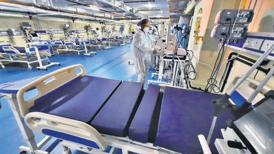 Thane, India - December 22, 2022: Thane Municipal Corporation COVID-19 Centre staff ready ICU beds according to the instructions by Central Government to all States to be on high alert as Covid-19 cases are rising in China and several other countries, at TMC's Parking Plaza Covid Cente, in Thane, India, on Thursday, December 22, 2022. (Praful Gangurde/HT Photo) (HT PHOTO) Thane, India - December 22, 2022: Thane Municipal Corporation COVID-19 Centre staff ready ICU beds according to the instructions by Central Government to all States to be on high alert as Covid-19 cases are rising in China and several other countries, at TMC's Parking Plaza Covid Cente, in Thane, India, on Thursday, December 22, 2022. (Praful Gangurde/HT Photo) (HT PHOTO)