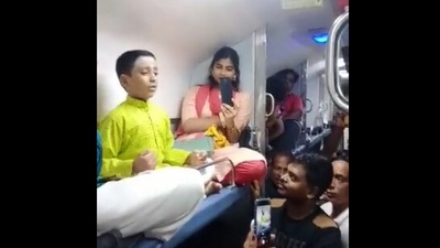 The image is taken from the Twitter video that shows the kid's classical music performance on train. (Twitter/@VarierSangitha)