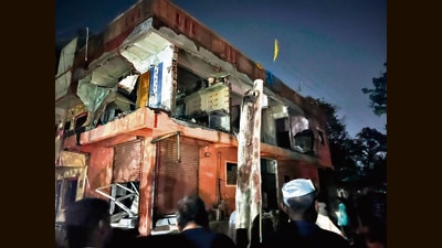 Two people were killed in an explosion caused by cooking gas leakage in a two-storey building in Ranubai mala area of Chakan on Wednesday. A wall also collapsed due to the explosion. (HT PHOTO)
