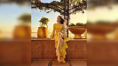 Manushi Chhillar's dress features one shoulder with a waist cut-out and frill asymmetrical detailing. (Instagram/@manushi_chhillar) Manushi Chhillar's dress features one shoulder with a waist cut-out and frill asymmetrical detailing. (Instagram/@manushi_chhillar)