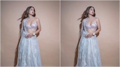 Hina further added more oomph to her look with a silver satin dupatta on one shoulder featuring silver patchwork. (Instagram/@realhinakhan) Hina further added more oomph to her look with a silver satin dupatta on one shoulder featuring silver patchwork. (Instagram/@realhinakhan)