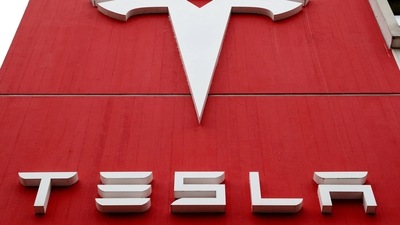 The logo of car manufacturer Tesla is seen at a branch office in Bern, Switzerland. (REUTERS)