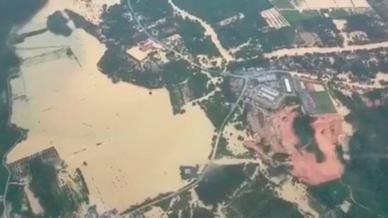 An aerial view shows flooded neighborhoods on the east-coast of peninsular Malaysia on December 19. The Department of Irrigation and Drainage (DID) has warned of more floods in the comings days as the monsoon season, which lasts from October to March, carries on, Reuters reported.&nbsp;(Facebook / Korporat JBPM / Reuters)