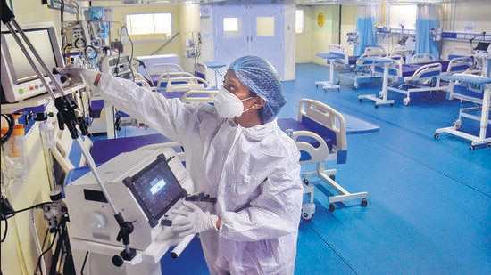 A medic at Thane Municipal Corporation's Covid Center checks equipment as part of preparedness. (PTI)