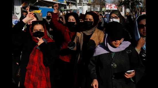 Afghan women chant slogans in protest against the closure of universities to women by the Taliban in Kabul, Afghanistan, on Thursday. (REUTERS)