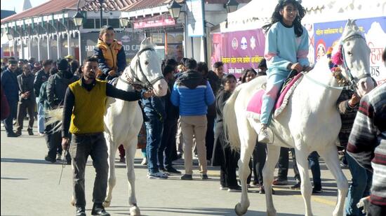 Children enjoy horseback rides on a sunny day on The Ridge in Shimla on Thursday. (Deepak Sansta/HT)