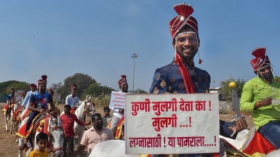 Youths in bridal finery sitting on horses take out a rally campaigning to save the girls, in Solapur, Wednesday.(PTI)