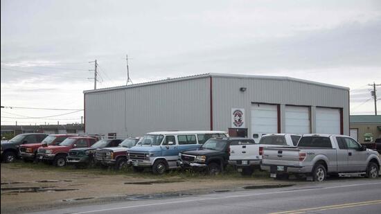 Pick-up, van and cars in Churchill, Manitoba, northern Canada. (AFP)